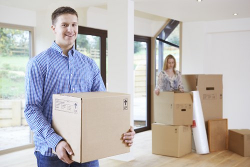 Removal team planning a move in Islington with packed boxes and furniture