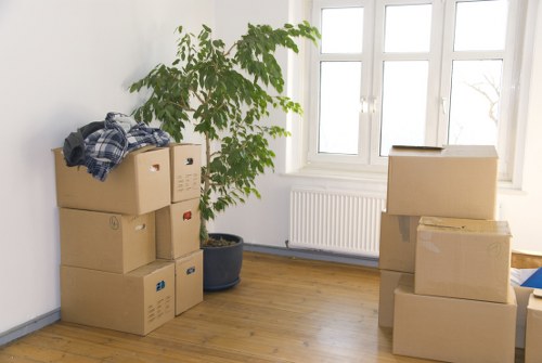 Packed moving boxes and labels ready for a house move in Islington