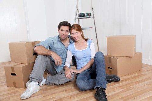 Local removals team handling furniture in an Islington property